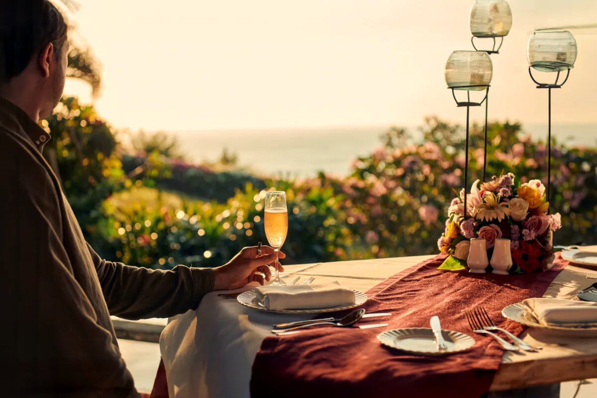 A private dinner table at a tropical Bali villa in warm evening light